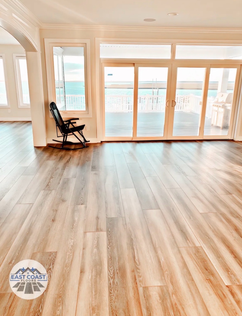 Wide plank flooring with ocean view by East Coast Floors